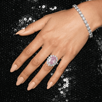 Pink oval sapphire halo cocktail ring side view