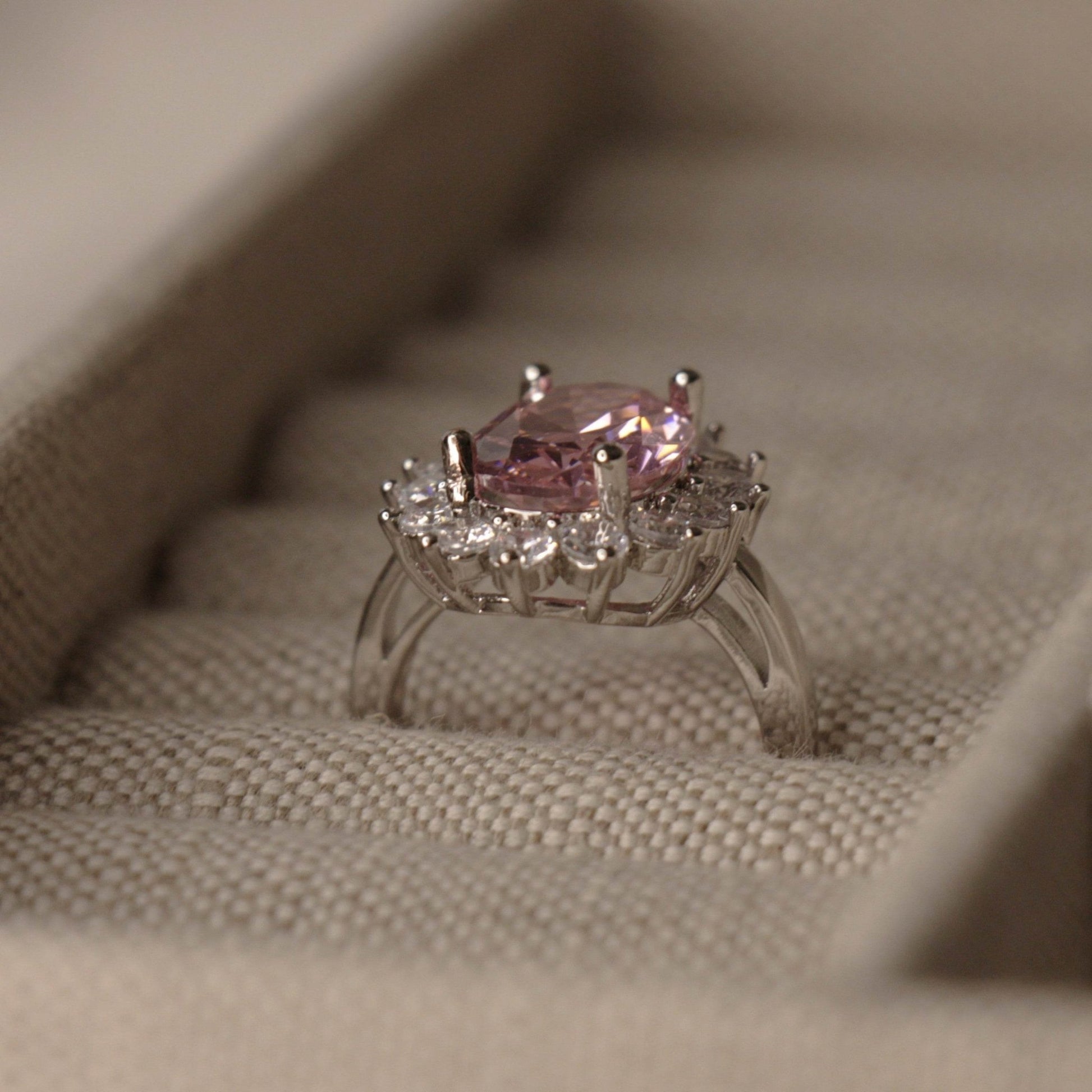 Pink oval sapphire halo cocktail ring detail