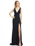 This stunning, midnight, sleeveless faux-wrap v-neck jersey gown featuring a plunging-v back, gathered sweeping train, and high front slit is a beautiful, full-length evening dress perfect for proms, black-tie affairs, weddings and special events!
