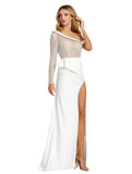 This elegant Mac Duggal ivory, bridal perfect, floor-length, asymmetric one sleeved illusion gown features punch pearls and rhinestones throughout the bodice and sleeve to create beautiful bridal detail. Finished with a crepe jersey skirt to hug your every curve and accented by a modern pin-tucked side peplum and thigh-high slit.This gown is perfect for proms, black-tie affairs, weddings, brides and special events!