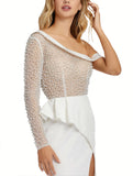 This elegant Mac Duggal ivory, bridal perfect, floor-length, asymmetric one sleeved illusion gown features punch pearls and rhinestones throughout the bodice and sleeve to create beautiful bridal detail. Finished with a crepe jersey skirt to hug your every curve and accented by a modern pin-tucked side peplum and thigh-high slit.This gown is perfect for proms, black-tie affairs, weddings, brides and special events close up