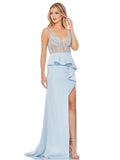 This elegant Mac Duggal powder blue, evening dress is a beautiful, long, simple and sleek, chic gown with a sheer bodice, thigh-high slit, ruffled peplum waist, and a sweeping train. The natural waist is defined by a hand beaded belt. This gown is perfect for proms, black-tie affairs, weddings and special events!