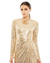 This elegant Mac Duggal, long, gold, hand-sequined gown is a fashion-forward choice for any formal affair. With a high round neckline, long sleeves, and a floor-grazing skirt, this modest silhouette is accented by a draped skirt and inset waist detail. Sleeves feature hidden zippers for ease of dressing. This elegant evening dress is the perfect dress perfect for proms, black-tie affairs, weddings and special events close up