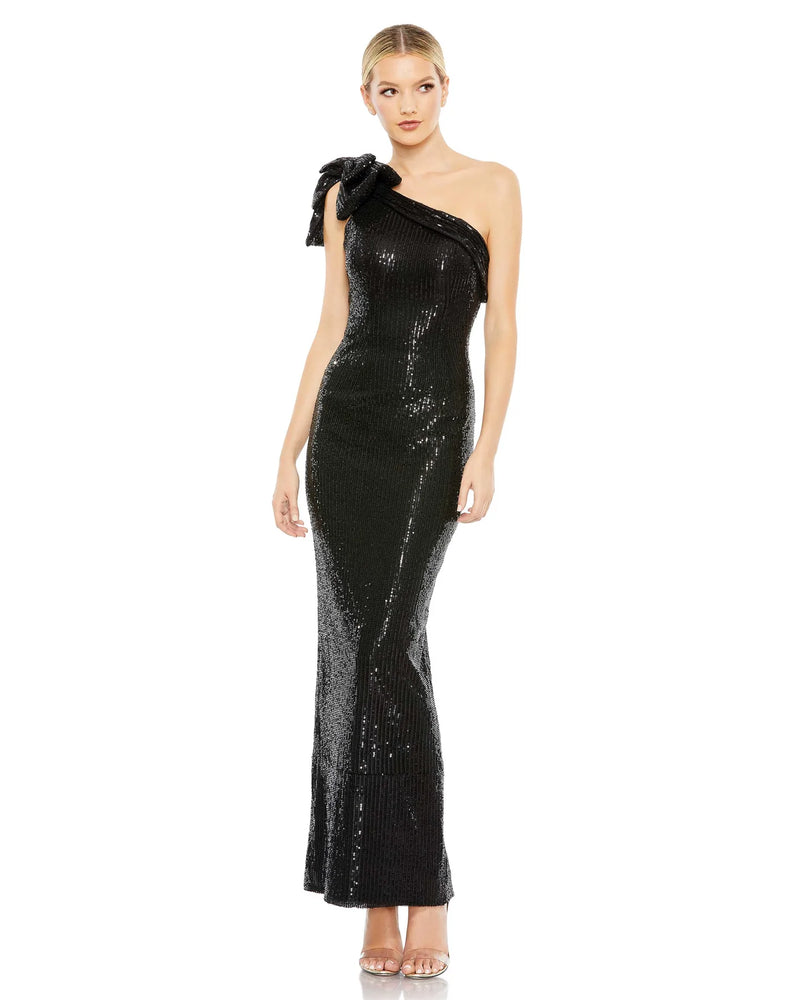 This stunning Mac Duggal elegant, asymmetric black stretch sequin midi length cocktail dress features a gorgeous bow detail accent on one sleeve! Crafted in a sexy, bodycon fit, this dress is elegant and sophisticated. This dress is perfect for proms, weddings and special events!