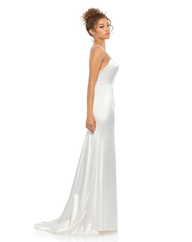 This elegant white, bridal perfect, floor length, fitted, formal dress is picture perfect. With an elongating column style and liquid satin fabric, this gown is both elegant and sophisticated. This floor length dress features a dazzling embellished crystal encrusted straps with a touch of a sweetheart neckline finished with a glamorous sweeping train side view