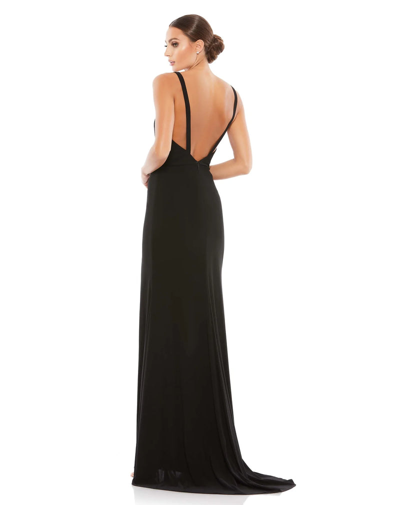 This vampy, Jessica Rabbit of a dress is a floor-length, strapless black, bodycon, fitted gown with a plunging V shaped bust, banding at the waist to cinch you in and one sexy thigh high split for added drama, finished perfectly with a little train. With stunning strap detail at the back, this evening dress is just as show-stopping from the back as it is from the front! This gown is perfect for proms, black-tie affairs, weddings and special events back view
