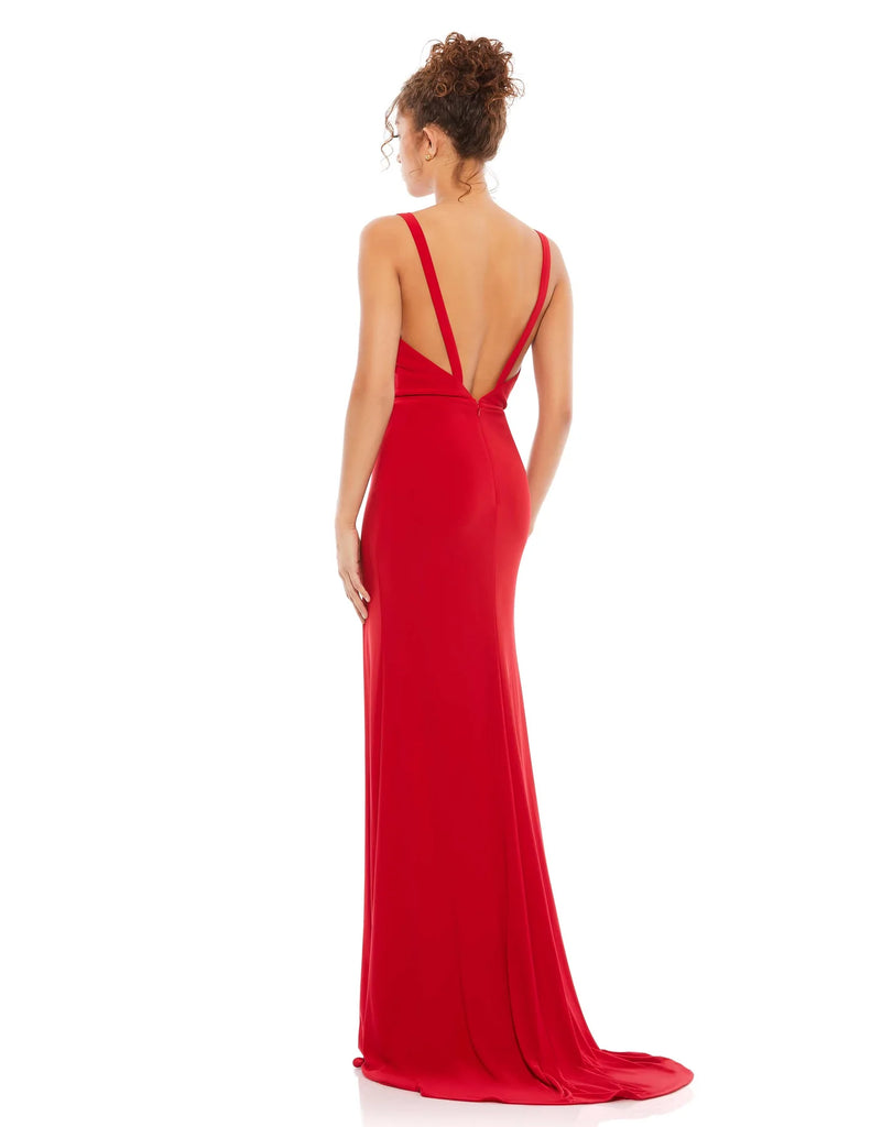 This vampy, Jessica Rabbit of a dress is a floor-length, strapless red bodycon, fitted gown with a plunging V shaped bust, banding at the waist to cinch you in and one sexy thigh high split for added drama, finished perfectly with a little train. With stunning strap detail at the back, this evening dress is just as show-stopping from the back as it is from the front! This gown is perfect for proms, black-tie affairs, weddings and special events back view