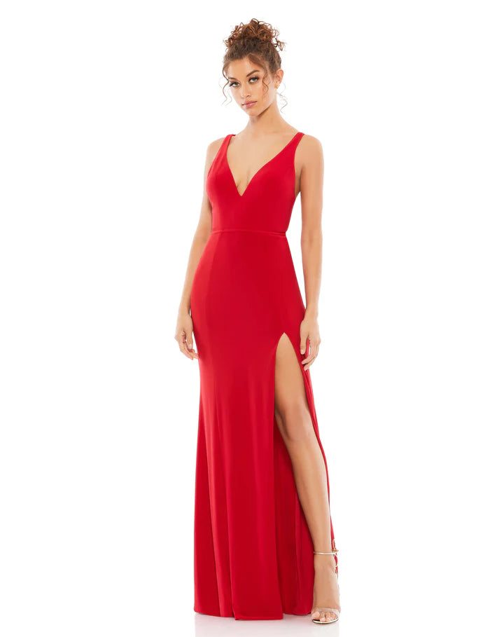 This vampy, Jessica Rabbit of a dress is a floor-length, strapless red bodycon, fitted gown with a plunging V shaped bust, banding at the waist to cinch you in and one sexy thigh high split for added drama, finished perfectly with a little train. With stunning strap detail at the back, this evening dress is just as show-stopping from the back as it is from the front! This gown is perfect for proms, black-tie affairs, weddings and special events!
