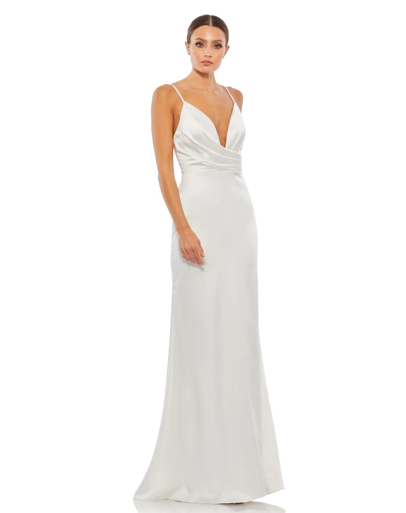 This elegant Grecian inspired, Mac Duggal white, bridal perfect, floor-length, faux-wrap evening gown features delicate spaghetti straps, a plunging chest, a fitted bodycon fit and a sweeping train. This charmeuse gown is perfect for proms, black-tie affairs, weddings, brides and special events!