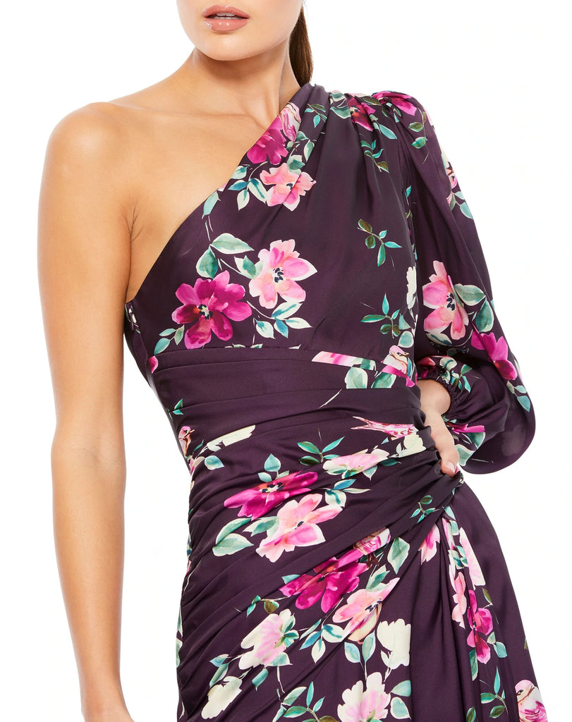 This stunning one-sleeve charmeuse floral-print gown in gorgeous plum colour is completed with a high slit and hand-sewn ruching to accent the waist is the perfect dress for Summer weddings and special events close up