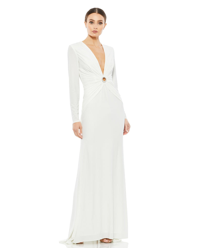 This elegant Mac Duggal long, white, long-sleeve jersey gown with a plunging v-neckline, gathered waist, and jewelled keyhole midriff is the perfect dress perfect for proms, black-tie affairs, weddings and special events!