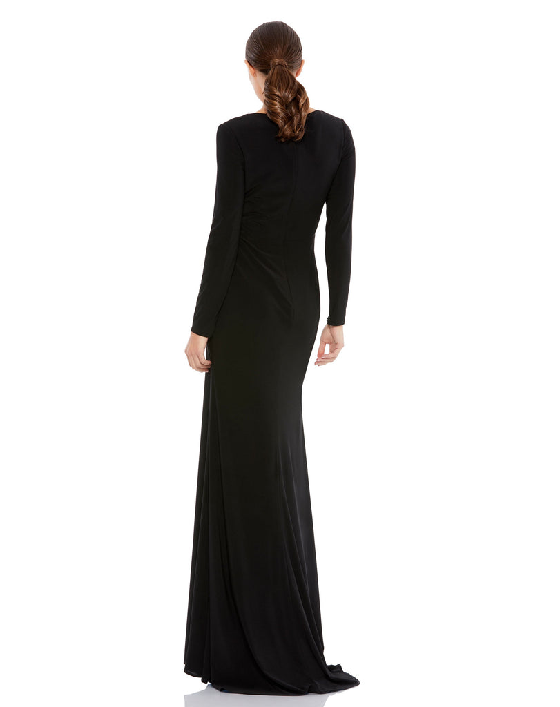 This elegant Mac Duggal long, black, long-sleeve jersey gown with a plunging v-neckline, gathered waist, and jewelled keyhole midriff is the perfect dress perfect for proms, black-tie affairs, weddings and special events! back
