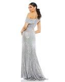 This elegant Mac Duggal platinum silver sequin, evening dress is a beautiful, long, floor-length, simple and sleek, sequined off-the-shoulder evening gown with a fitted ruched bodice. The floor-length skirt features a sweeping train and a sexy thigh-high slit. This gown is perfect for proms, black-tie affairs, weddings and special events back view