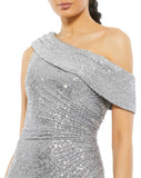 This elegant Mac Duggal platinum silver sequin, evening dress is a beautiful, long, floor-length, simple and sleek, sequined off-the-shoulder evening gown with a fitted ruched bodice. The floor-length skirt features a sweeping train and a sexy thigh-high slit. This gown is perfect for proms, black-tie affairs, weddings and special events close up