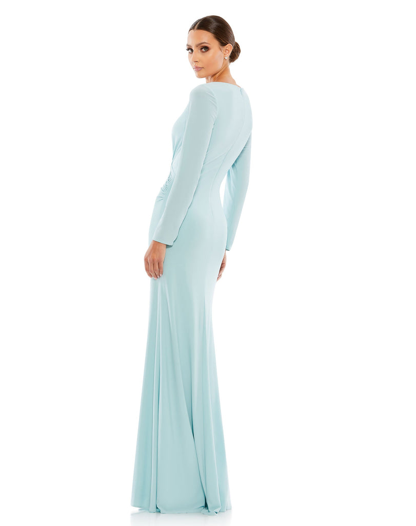 This elegant Mac Duggal powder-blue, evening dress is a beautiful, long, simple and sleek, chic jersey gown. Cut with a curve-hugging fit, the dress is fashioned with a deep surplice neckline, long sleeves and pleating at the waist. This gown is perfect for proms, black-tie affairs, weddings and special events! back
