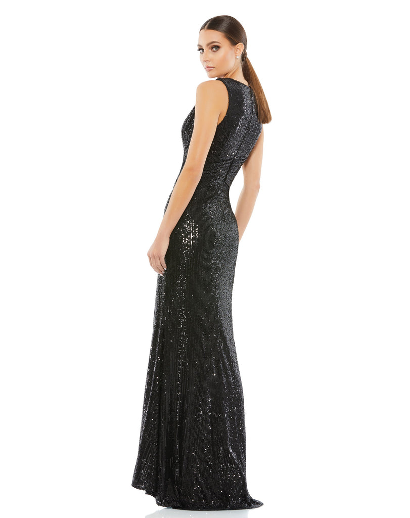 This elegant Mac Duggal, long, black, floor-length sequined gown with a plunging v-neckline, wrap waist, and a thigh-high slit. This elegant evening dress is the perfect dress perfect for proms, black-tie affairs, weddings and special events! side