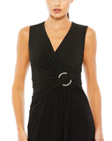 This elegant Mac Duggal floor-length, black short sleeve, evening dress is a beautiful, long, simple and sleek, jersey gown with gathering at the waist finished with a rhinestone buckle and a sexy leg slit to create easy and simple movement. This gown is perfect for proms, black-tie affairs, weddings, brides and special events close up