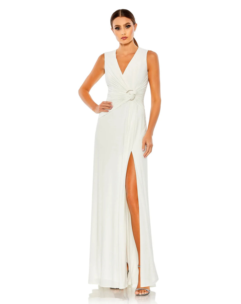 This elegant Mac Duggal floor-length, short sleeve, evening dress is a beautiful, long, simple and sleek, jersey gown with gathering at the waist finished with a rhinestone buckle and a sexy leg slit to create easy and simple movement. This gown is perfect for proms, black-tie affairs, weddings, brides and special events!