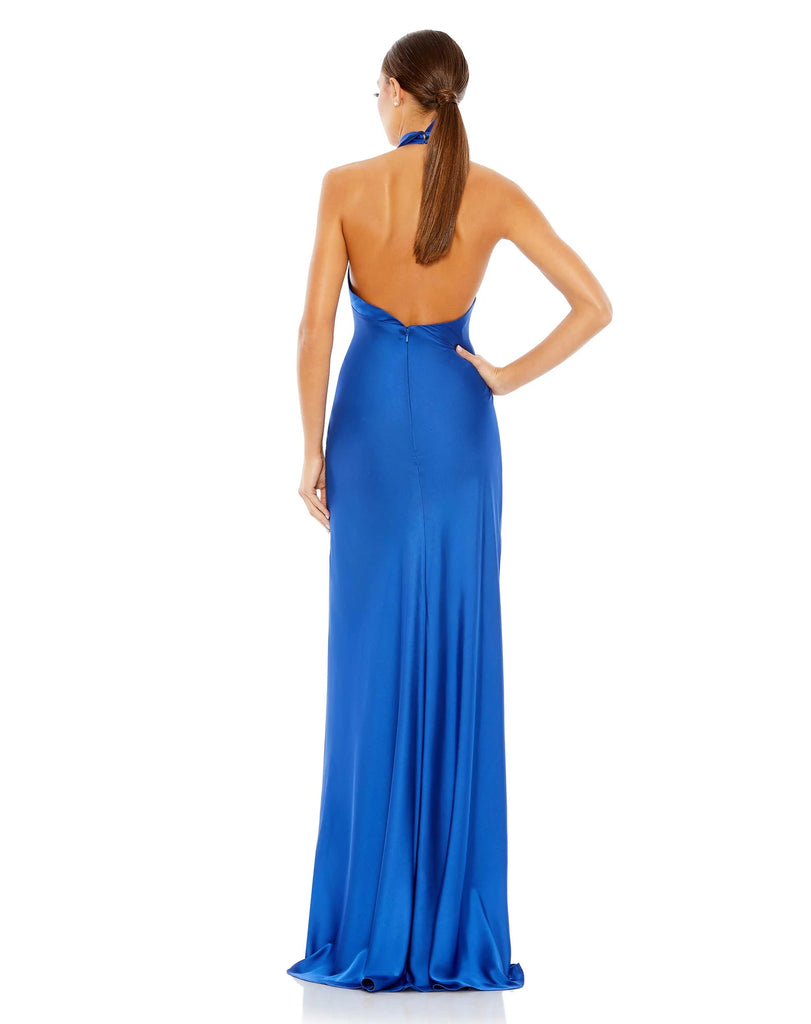 Made in a stunning shade of cobalt blue, this elegant and sophisticated, silky satin gown features a twister halter neck, fitted body and one sexy thigh high split formed from a sexy train.  The dress, with its show-stopping colour will be sure to have all eyes on you back