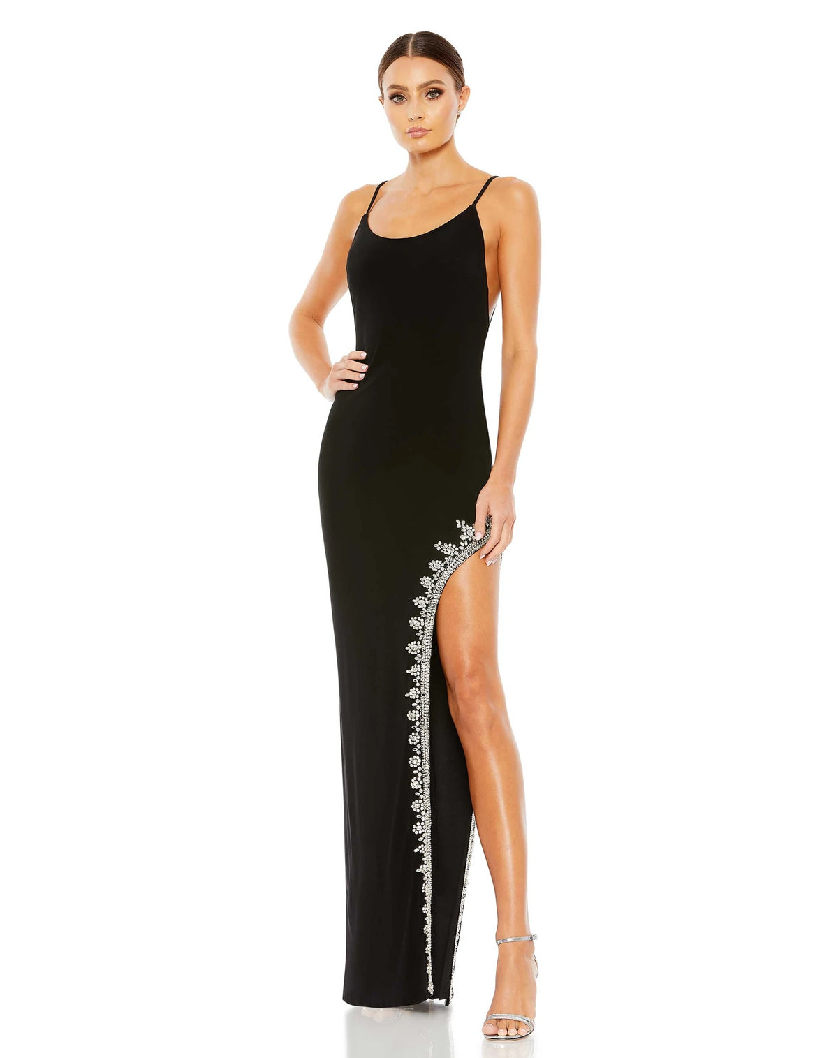 This elegant Mac Duggal, long, black, asymmetric evening gown with sexy crystal detail on the skirt is and an open back is a met gala inspired gown for a very special occasion! This elegant evening dress is the perfect dress perfect for proms, black-tie affairs, wedding guest and special events!