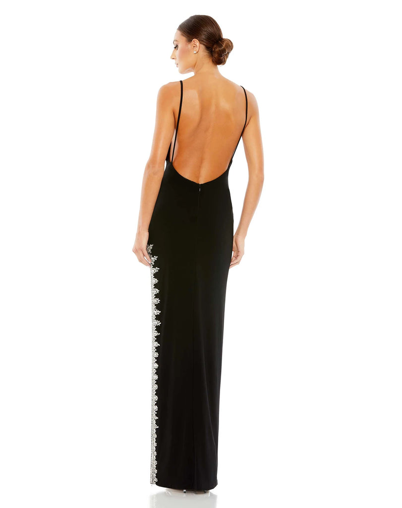 This elegant Mac Duggal, long, black, asymmetric evening gown with sexy crystal detail on the skirt is and an open back is a met gala inspired gown for a very special occasion! This elegant evening dress is the perfect dress perfect for proms, black-tie affairs, wedding guest and special events! prom dress