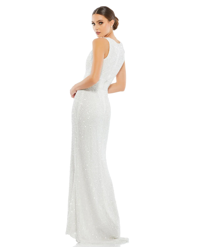 This elegant Grecian inspired, Mac Duggal white, bridal perfect, floor-length evening gown is covered top-to-bottom in stunning sequins. The plunging scalloped neckline is trimmed with beads, and a wide hand-beaded waistband cinches in the midsection. The floor-length skirt is finished with a sweeping train. This sleeveless gown is perfect for proms, black-tie affairs, weddings, brides and special events side view