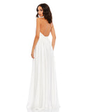 This elegant white floor length, halterneck, sleeveless evening gown is perfect for brides and brides to be! Crafted with delicate chiffon, this dress features a ruched bodice and waistband, together with an open back, and a rosette neckline. The flowing  floor-length skirt features a thigh-high slit for a dramatic finish back view
