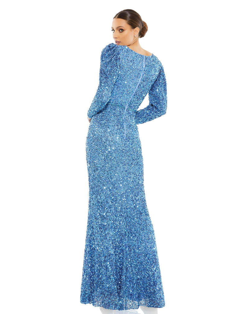 This stunning Mac Duggal elegant long-sleeved, French Blue, sequin, evening gown is a beautiful, full-length sequin-stitched column gown. The demure design is styled with a pleated surplice neckline, long sleeves with puff shoulders, a hand-beaded waist, and a sweep train. It’s a gorgeous show-stopping choice for your next formal event. back