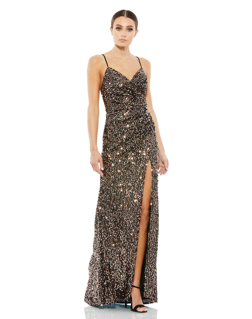 This elegant Mac Duggal, long, metallic bronze, spaghetti strap gown with a faux wrap front, a gathered waist, and a smouldering high slit. The gown features spaghetti straps, a v-neckline, and a plunging open back. Built-in bust pads provide coverage and support. This elegant evening dress is the perfect dress perfect for proms, black-tie affairs, weddings and special events!