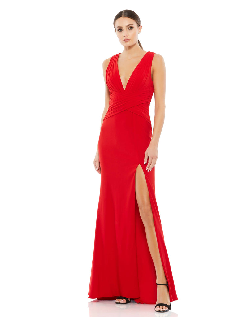This elegant red Mac Duggal long deep V-neckline, sleeveless shoulders, a pleated, crisscrossed waist, and a sexy slit. It’s minimalist elegance at its finest. This special occasion dress is perfect for proms, black-tie affairs, weddings and special events!