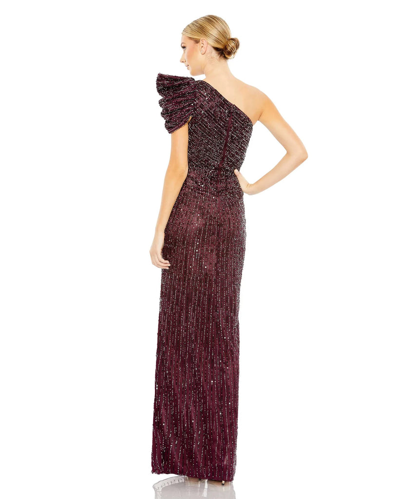 This beautiful dark purple coloured sequin, one-shoulder, asymmetric floor-length, evening gown with a beautiful cinched waist and puff detail on the shoulder is an elegant gown for special occasions and events with one thigh high split and an elegant form-fitting fit baclk view