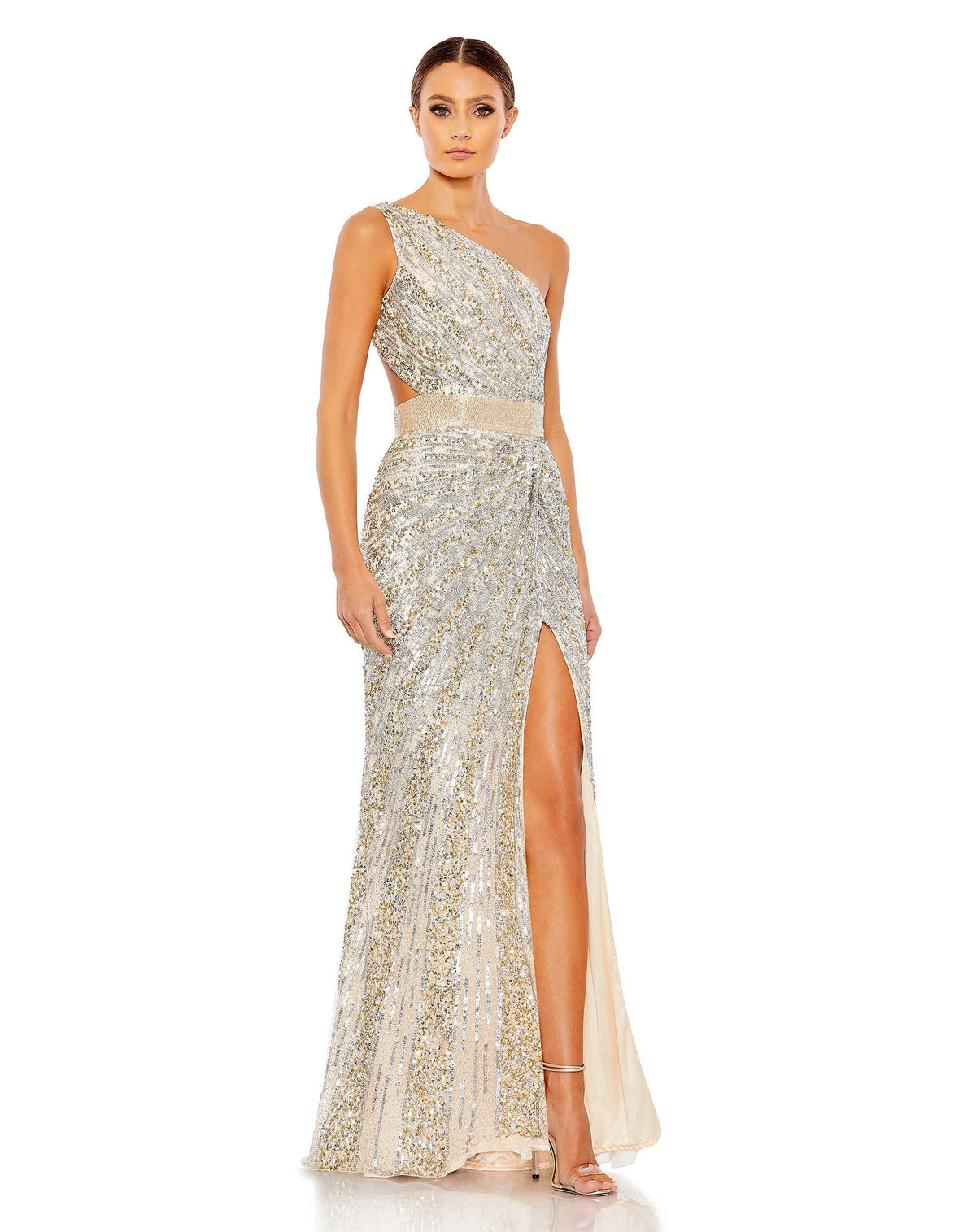 This elegant Mac Duggal, long, sequin, silver nude, asymmetric shoulder gown with sexy cut out detail at the waist, and a smouldering high slit is a met gala inspired gown for a very special occasion! This elegant evening dress is the perfect dress perfect for proms, black-tie affairs, wedding guest and special events!