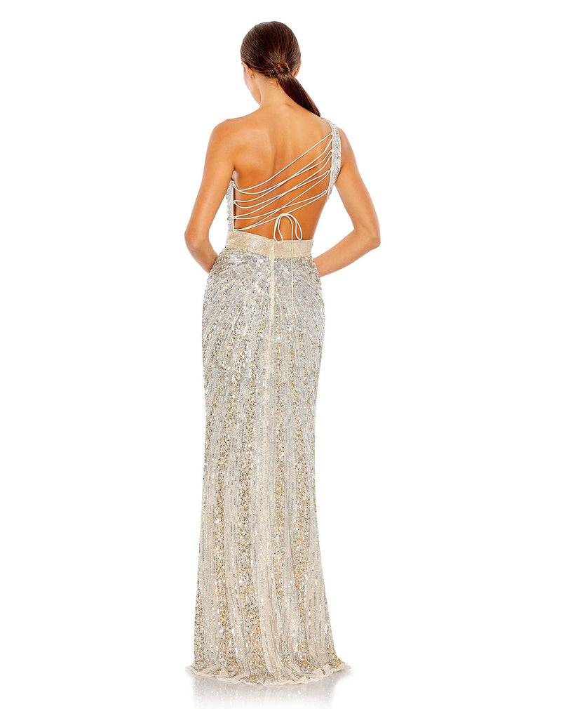This elegant Mac Duggal, long, sequin, silver nude, asymmetric shoulder gown with sexy cut out detail at the waist, and a smouldering high slit is a met gala inspired gown for a very special occasion! This elegant evening dress is the perfect dress perfect for proms, black-tie affairs, wedding guest and special events! back