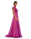 This elegant Mac Duggal one-sleeved raspberry, dress is a stunning formal gown for special occasions. With beautiful draped asymmetric detail across one shoulder and an empire bust together with a flower skirt, this elegant gown will truly have you feeling like the belle of the ball. side view