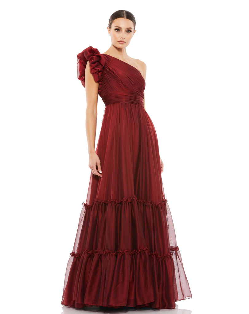 Be prepared for non-stop compliments in this dreamy wine formal dress. Between the iridescent organza fabric, texture-rich plissé pleating, avant-garde-inspired ruffled shoulder, and a billowy tiered skirt, this gown is guaranteed to turn every head in the room. This beautiful Grecian inspired, long formal dress is perfect for wedding guests and special occasions! 