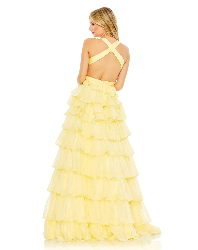 This show-stopping, lemon yellow, prom dress is styled with a pleated bodice with a deep neckline, waist cutouts, and crisscross centre providing the perfect amount of cleavage. With decadent layers of graduated ruffles fill out the full skirt for a design that’s festive and flirty, perfect for Summer weddings and parties back view