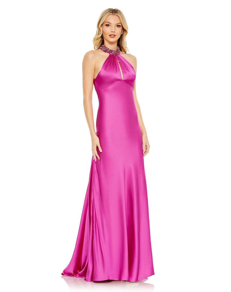This elegant hot pink fuchsia coloured formal dress is picture perfect for proms, weddings and special occasions! With an elongating column style fit and halterneck, crafted with liquid satin fabric, this gown is both elegant and sophisticated. This floor length dress features a dazzling embellished halter-neck collar, with a touch of gathering and a slender keyhole cutout before it finishes with a revealing back and glamorous sweep train.