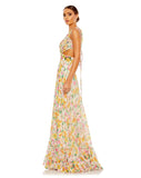 This show-stopping, floral print, floor length evening gown with sexy side cut-out detail features pleating at the bust tapering down into a hand embroidered waist followed by a full skirt with tiered detail at the hem. With elegant strappy tie-up detail at the back, this gown exposes a little sexy back for all your photos to be truly sensational from any angle! This A line dress is the perfect gown for special occasions, weddings and Summery parties side view