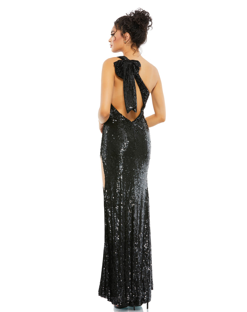 This stunning Mac Duggal elegant evening gown is a beautiful Jessica Rabbit, sexy one-shoulder detail and asymmetrical silhouette, full sequin evening dress! With bow detail at the back, this daring, black dress is perfect for proms, weddings and special events! BACK