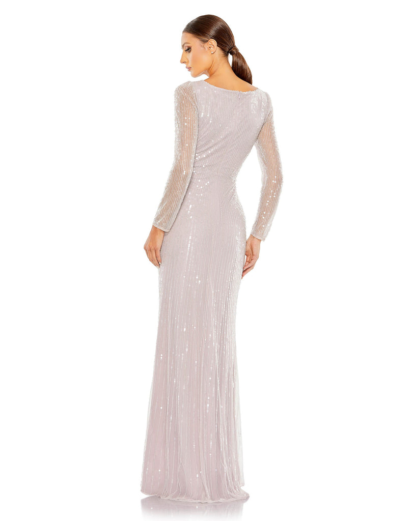 This stunning Mac Duggal elegant long-sleeved, lavender, evening gown is a beautiful, full-length evening dress with faux-wrap detail and all over sequins. With one sexy-thigh high split, dress is perfect for proms, weddings and special events! back