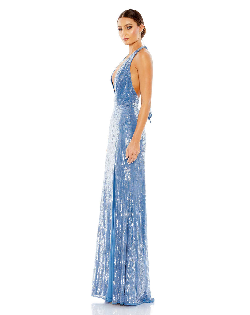 This sexy Mac Duggal, floor-length, sequinned cerulean/aqua blue evening gown is a super-sexy, black-tie dress for that special occasion! With a plunging V neck and a super sexy low-back with tie-up detail, this evening dress is for the daring! Perfect for prom, after-parties and weddings, you will certainly have all eyes on you side