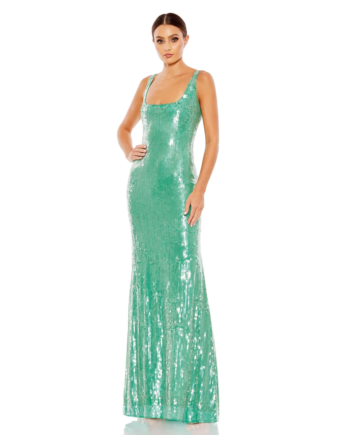 This elegant, floor-length, Mac Duggal, jade green sequin evening dress is a beautiful, long, simple and almost mermaid inspired evening gown. Coated in clear sequins that resemble sparkling water, crafted with bodycon, fitted material to hug your every curve and a low square neckline.This gown is perfect for proms, black-tie affairs, weddings and special events!