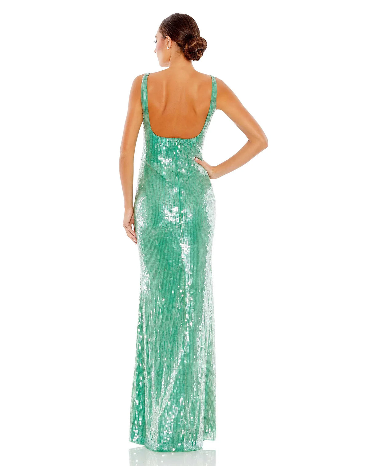 This elegant, floor-length, Mac Duggal, jade green sequin evening dress is a beautiful, long, simple and almost mermaid inspired evening gown. Coated in clear sequins that resemble sparkling water, crafted with bodycon, fitted material to hug your every curve and a low square neckline.This gown is perfect for proms, black-tie affairs, weddings and special events back view
